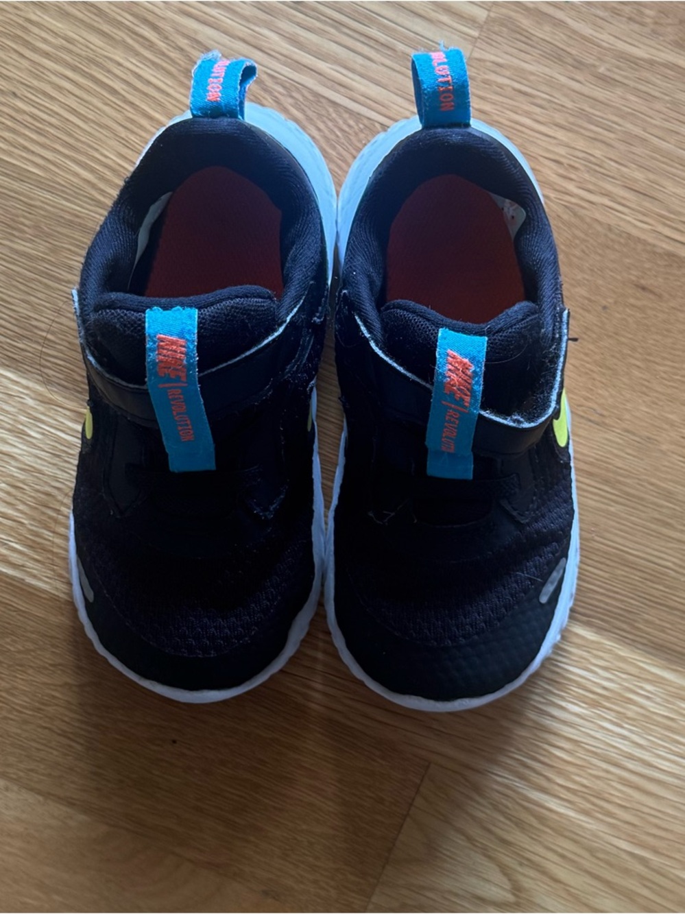 Nike Kids Black Slip-On Sneakers with Blue and Neon Yellow Accents